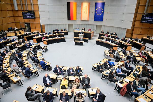 Members of parliament from the SPD, Green and Left parties turn their backs to the speaker during a speech by Martin Trefzer (AfD), member of the Berlin House of Representatives, during the 60th plenary session of the Berlin House of Representatives, in Berlin, Thursday, Jan. 30, 2024. (Sebastian Christoph Gollnow/dpa via AP)