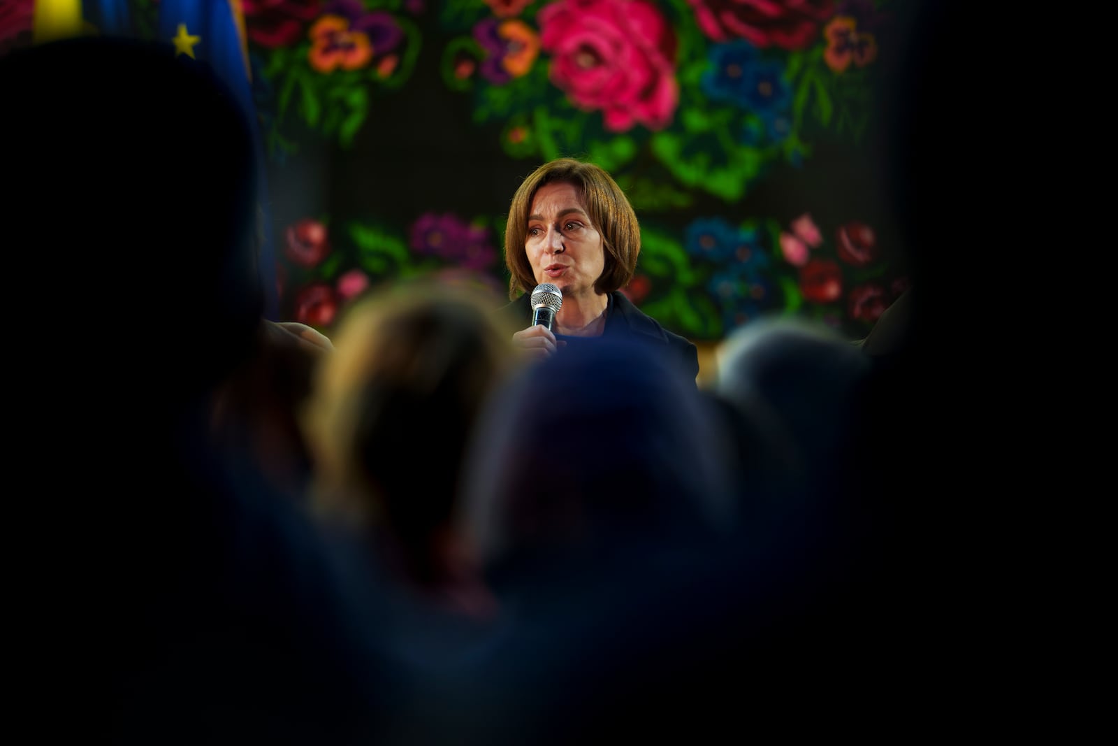 Moldova's President Maia Sandu speaks to people in Magdacesti, Moldova, Thursday, Oct. 17, 2024, as she seeks a second term in office ahead of a presidential election and a referendum of whether to enshrine in Moldova's Constitution its path to European Union membership taking place on Oct.20. (AP Photo/Vadim Ghirda)