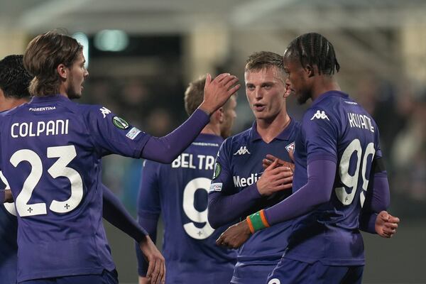 Fiorentina's Albert Gudmundsson, centre right, celebrates with teammates after scroing his side's seventh goal during the Europa Conference League opening phase soccer match between Fiorentina and LASK at the Artemio Franchi Stadium in Florence, Italy, Thursday Dec. 12, 2024. (Massimo Paolone/LaPresse via AP)