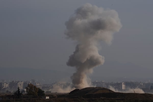 Smoke rises after an Israeli airstrike on an area in the outskirts of Damascus, Syria, Thursday, Dec. 12, 2024. (AP Photo/Leo Correa)