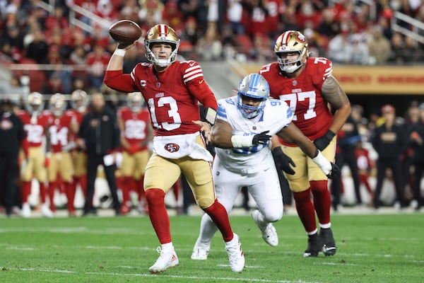 San Francisco 49ers quarterback Brock Purdy (13) runs for a touchdown during the first half of an NFL football game against the Detroit Lions, Monday, Dec. 30, 2024, in Santa Clara, Calif. (AP Photo/Jed Jacobsohn)