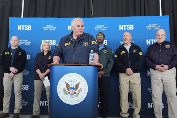 National Transportation Safety Board member Todd Inman speaks during a press conference at Ronald Reagan Washington National Airport, Thursday, Jan. 30, 2025, in Arlington, Va., as NTSB Board Chair Jennifer Homend an other board members, look on. (AP Photo/Stephanie Scarbrough)