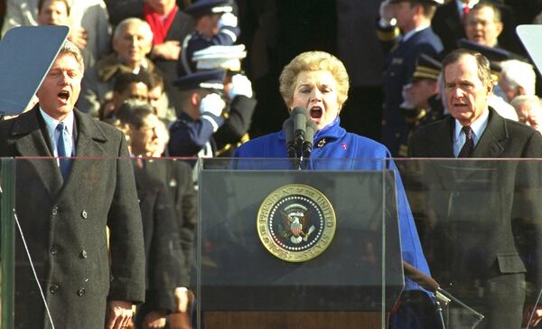 FILE - Mezzo soprano Marilyn Horne sings on Capitol Hill, January 20, 1993, joined by President Clinton, left, as former President Bush looks on during the inaugural ceremony. (AP Photo/Ron Edmonds, File)