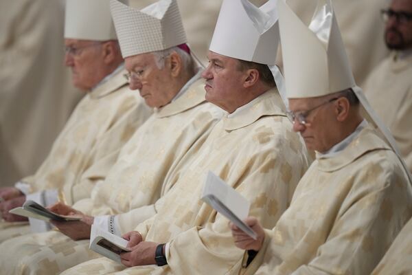 Bishops follow Pope Francis presiding over a mass in St. Peter's Basilica at The Vatican on New Year's Day, Wednesday, Jan. 1, 2025. (AP Photo/Andrew Medichini)