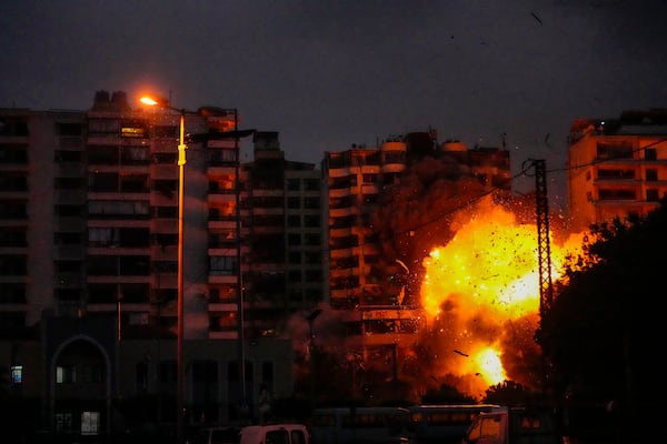 Smoke and flames erupt from an Israeli airstrike that targeted a building in Tayouneh, Beirut, Lebanon, Monday, Nov. 25, 2024. (AP Photo/Hassan Ammar)