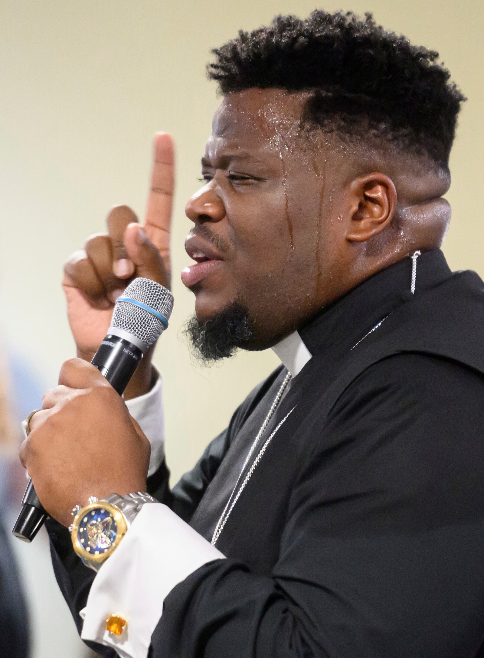 Pastor Rashad Singletary leads a service at Mt. Olive Baptist Church, Sunday, Aug. 18, 2024, in Turner Station, Md. Turner Station is located near the former site of the Francis Scott Key Bridge, which collapsed in March. (AP Photo/Steve Ruark)