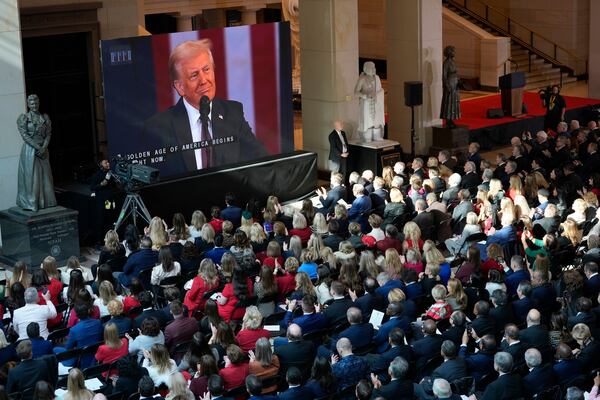 Guests watch from Emancipation Hall as President Donald Trump speaks at the 60th Presidential Inauguration, Monday, Jan. 20, 2025, at the U.S. Capitol in Washington. (Jasper Colt/Pool Photo via AP)