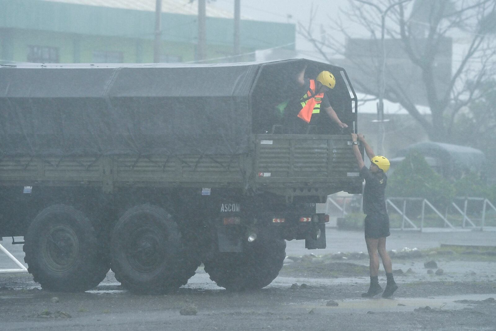 Rescuers prepare during heavy rains caused by Typhoon Usagi at Santa Ana, Cagayan province, northern Philippines on Thursday, Nov. 14, 2024. (AP Photo/Noel Celis)