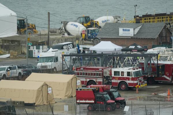 Emergency vehicles and recovery operations are seen near the mouth of the Anacostia River at the Potomac River near Ronald Reagan Washington National Airport, Friday, Jan. 31, 2025, in Washington. (AP Photo/Carolyn Kaster)