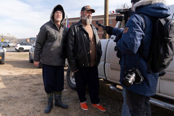 Supporters of President Donald Trump, Kevin Loftus, left and William Sarsfield III, who were convicted for participating in the Jan. 6 riot at the U.S. Capitol, talk to reporters after being pardoned and released in the early morning hours from the Philadelphia Federal Detention Center before traveling to Washington, Tuesday, Jan. 21, 2025. (AP Photo/Jose Luis Magana)