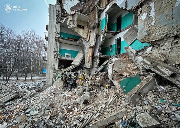 In this photo provided by the Ukrainian Emergency Services on Nov. 19, 2024, rescue workers clear the rubble of a residential building destroyed by a Russian strike in Hlukhiv, Ukraine. (Ukrainian Emergency Service via AP)