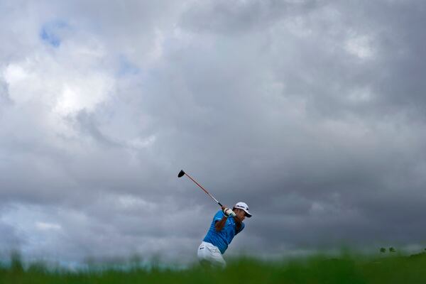 Hideki Matsuyama, of Japan, hits from the 13th tee during the first round of The Sentry golf event, Thursday, Jan. 2, 2025, at Kapalua Plantation Course in Kapalua, Hawaii. (AP Photo/Matt York)