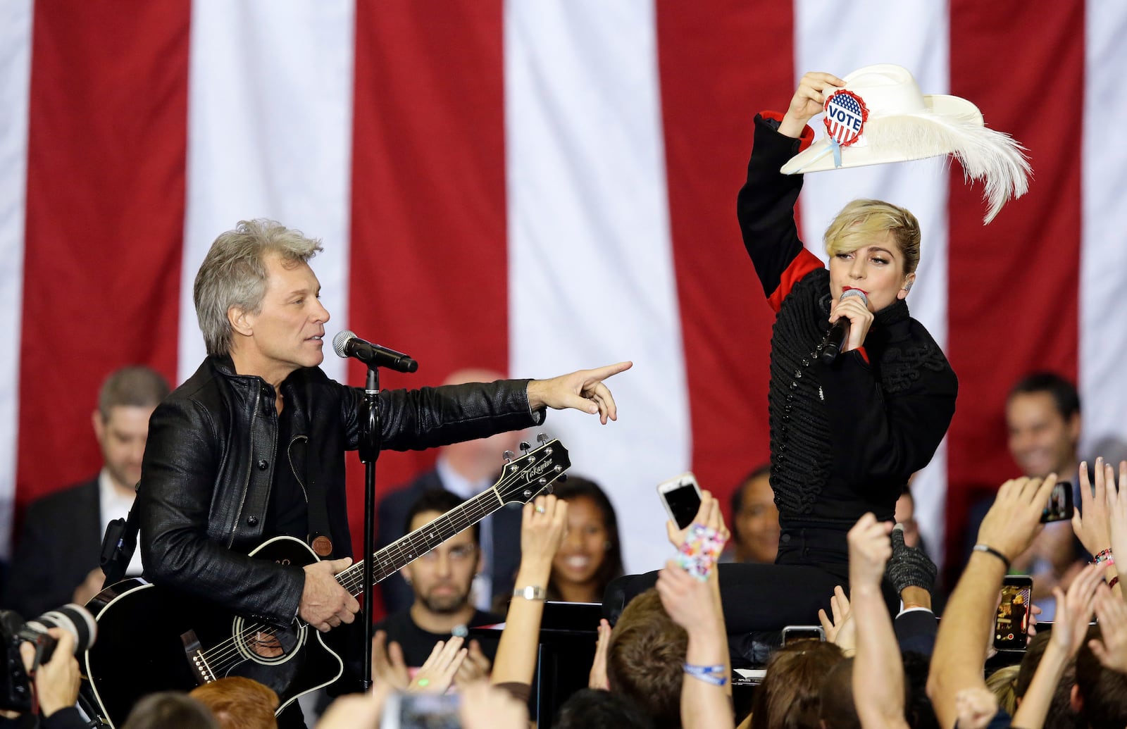 FILE - Jon Bon Jovi and Lady Gaga perform during a campaign rally for Democratic presidential candidate Hillary Clinton in Raleigh, N.C., Nov. 8, 2016. (AP Photo/Gerry Broome, File)