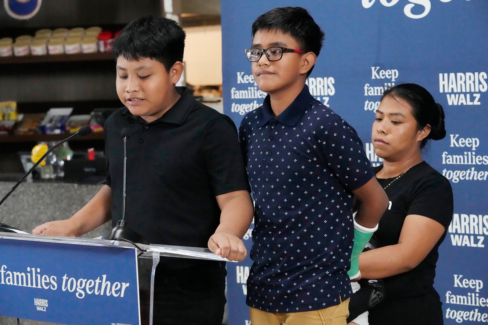 FILE- Christian and Hamilton, no last name given, speak during a Democratic Party campaign event about their experience on being separated from their mother Clairet when they crossed the U.S.- Mexico border during the Trump administration, Oct. 16, 2024, in Doral, Fla. (AP Photo/Marta Lavandier, File)