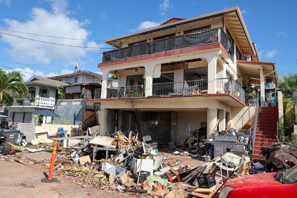 A view of the home where a New Year's Eve fireworks explosion killed and injured people, Wednesday, Jan. 1, 2025, in Honolulu. (AP Photo/Marco Garcia)