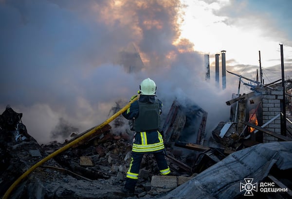 In this photo provided by the Ukrainian Emergency Service, firefighters put out the fire following a Russian rocket attack in Odesa region Ukraine, Sunday, Nov. 17, 2024. (Ukrainian Emergency Service via AP)