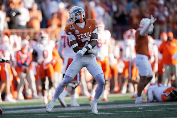 Texas defensive back Jahdae Barron (7) celebrates after a tackle during the first half against Clemson in the first round of the College Football Playoff, Saturday, Dec. 21, 2024, in Austin, Texas. (AP Photo/Eric Gay)