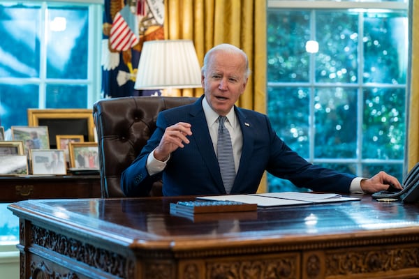 FILE - President Joe Biden speaks before signing an executive order to improve government services, in the Oval Office of the White House, Dec. 13, 2021, in Washington. (AP Photo/Evan Vucci, File)