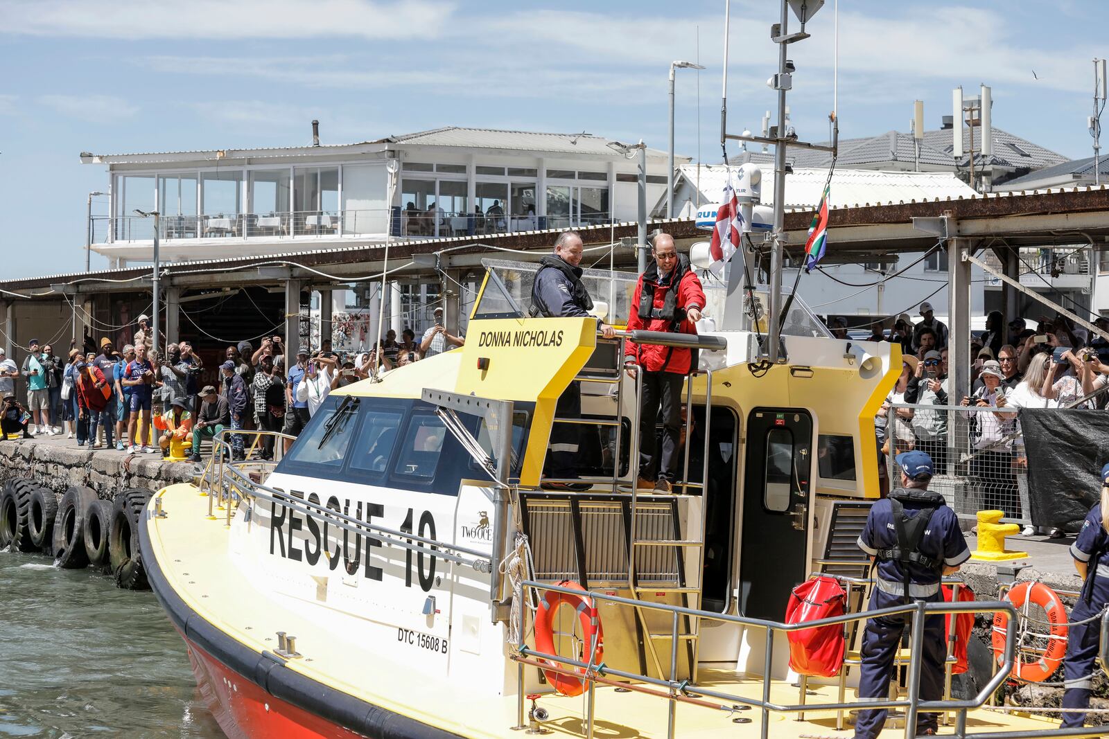 Britain's Prince William, the Prince of Wales, arrives on board a National Sea Rescue Institute (NSRI) boat to meet 2023 Earthshot finalist ABALOBI, at Kalk Bay Harbour, near Cape Town, Thursday, Nov. 7, 2024. (Gianluigi Guercia/Pool Photo via AP)