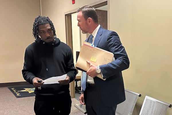 Jermarcus Johnson, left, speaks with his lawyer Josh Corman after Johnson was sentenced to probation for his role after the 2021 fatal shooting of Young Dolph on Friday, Nov. 22, 2024, in Memphis, Tenn. (AP Photo/Adrian Sainz).