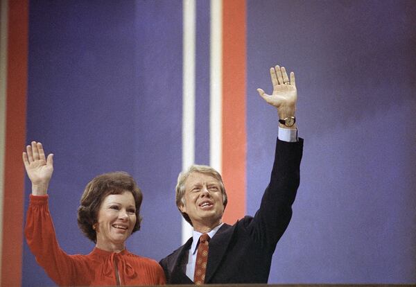 FILE - Jimmy Carter and his wife, Rosalynn, wave to supporters at the Democratic National Convention in Madison Square Garden in New York, July 15, 1976. (AP Photo, File)