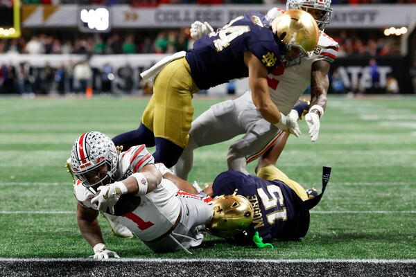 Ohio State running back Quinshon Judkins scores against Notre Dame during first half of the College Football Playoff national championship game Monday, Jan. 20, 2025, in Atlanta. (AP Photo/Butch Dill)