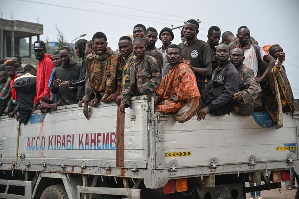 M23 rebels escort government soldiers and police who surrendered to an undisclosed location in Goma, Democratic republic of the Congo, Thursday, Jan. 30, 2025. (AP Photo/Moses Sawasawa)