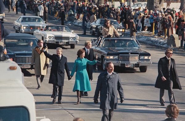 FILE - President Jimmy Carter and first lady Rosalynn Carter walk down Pennsylvania Avenue after Carter was sworn in as the nation's 39th president, Jan. 20, 1977, in Washington. (AP Photo, File)