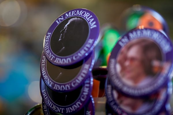 An In Memorium button for former President Jimmy Carter is seen inside the Plains Trading Post, Monday, Dec. 30, 2024, in Plains, Ga. Former President Jimmy Carter died Sunday at the age of 100. (AP Photo/Mike Stewart)