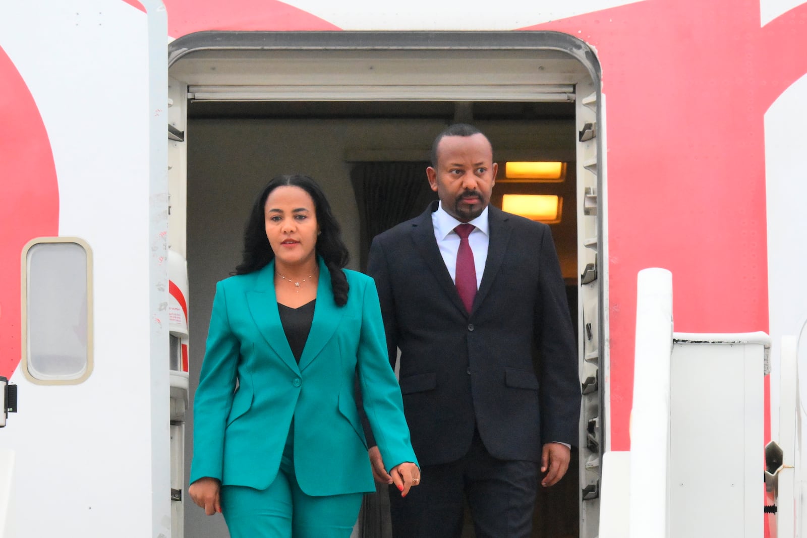 Ethiopian Prime Minister Abiy Ahmed and his wife Zinash Tayachew arrive at Kazan International Airport for the BRICS summit in Kazan, Russia, Tuesday, Oct. 22, 2024. (Ilya Pitalev/Photo host brics-russia2024.ru via AP)