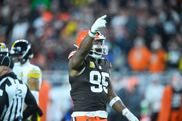 Cleveland Browns defensive end Myles Garrett (95) reacts after a defensive stop in the first half of an NFL football game against the Pittsburgh Steelers, Thursday, Nov. 21, 2024, in Cleveland. (AP Photo/David Richard)