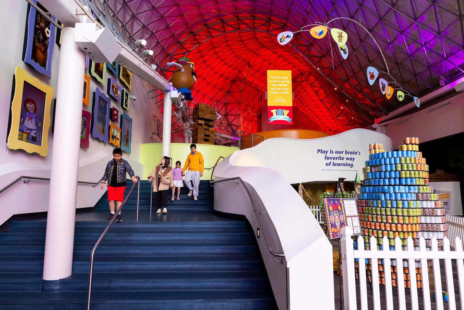 Visitors walk through the Toy Hall of Fame inside The Strong National Museum of Play, Tuesday, Oct. 15, 2024, in Rochester, N.Y. (AP Photo/Lauren Petracca)