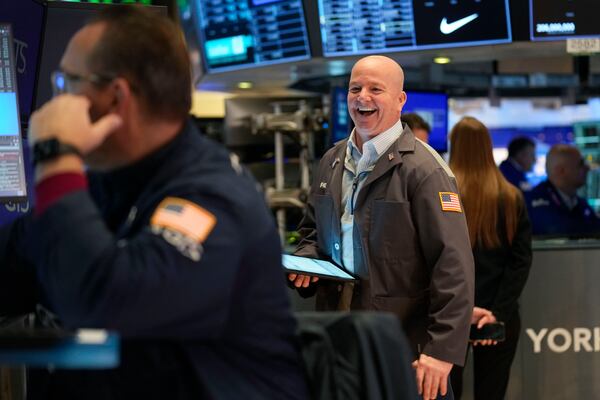 Traders work on the floor at the New York Stock Exchange in New York, Thursday, Jan. 2, 2025. (AP Photo/Seth Wenig)