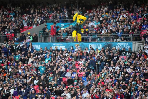 FILE - Jacksonville Jaguars mascot, Jaxson de Ville rappels from the Wembley Stadium roof during pregame of an NFL football game between the New England Patriots and the Jacksonville Jaguars, Sunday, Oct. 20, 2024, in London. (AP Photo/Kin Cheung, File)