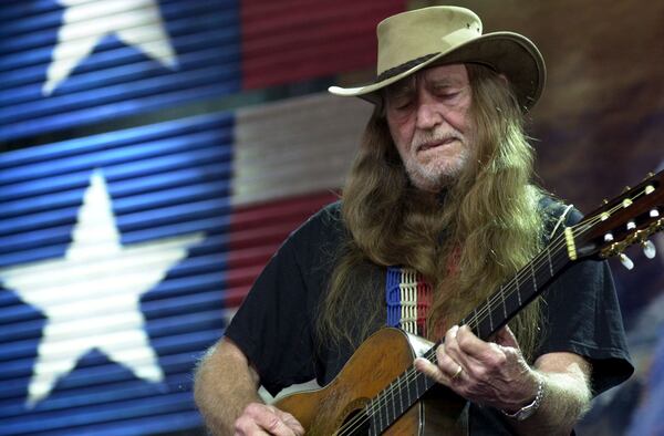 FILE - Willie Nelson performs at Farm Aid 2002 in Burgettstown, Pa., Saturday, Sept. 21, 2002. (AP Photo/Jasmine Gehris, File)