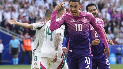Germany's Jamal Musiala (10) celebrates after scoring during a Group A match between Germany and Hungary at the Euro 2024 soccer tournament in Stuttgart, Germany, Wednesday, June 19, 2024. (AP Photo/Darko Vojinovic)